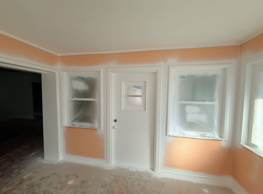 Interior door and trim primed and masked during a repaint
