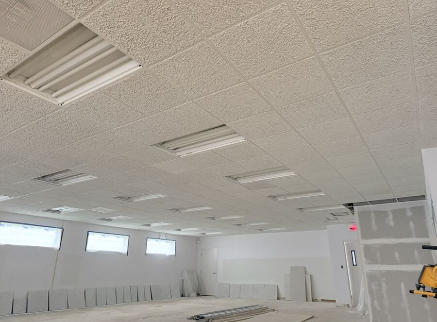 Commercial interior repaint with ceiling tiles and light fixtures
