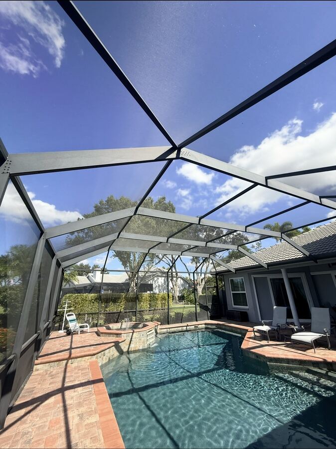 Repainted pool cage and screen enclosure over a Florida pool