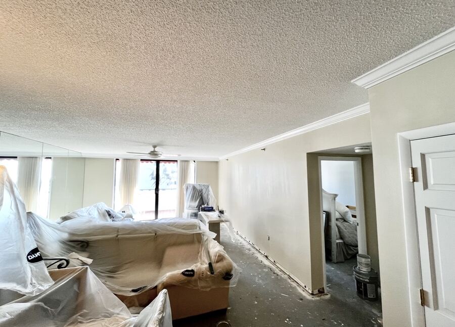Condo living room masked and prepped for interior painting