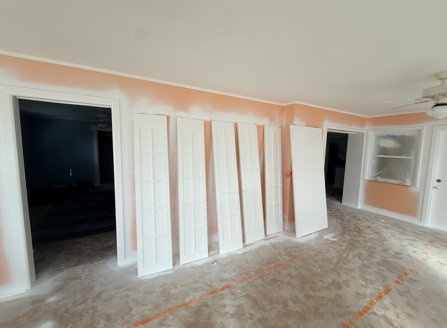 Bifold closet doors primed during an interior repaint