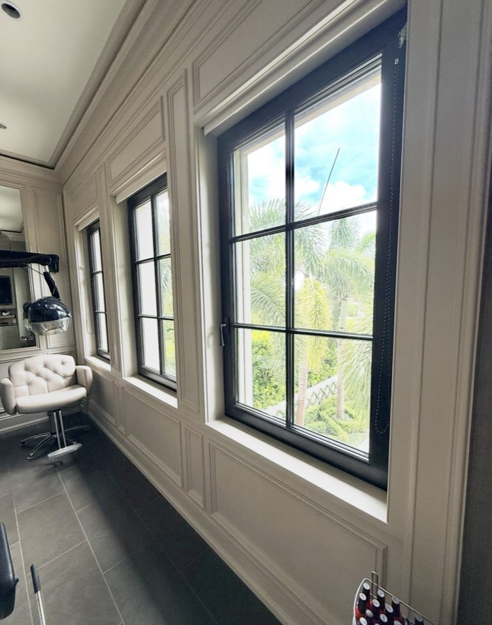 Painted wainscoting and window trim in a home salon and dressing room